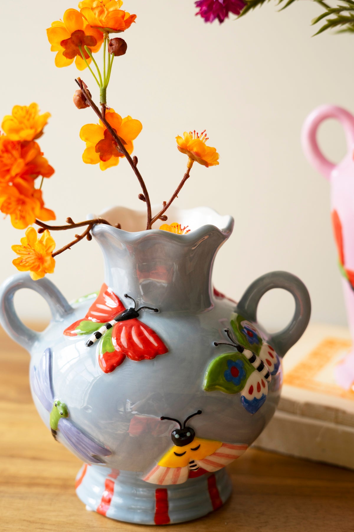 Set of Two Ceramic Butterfly and Moth Vases