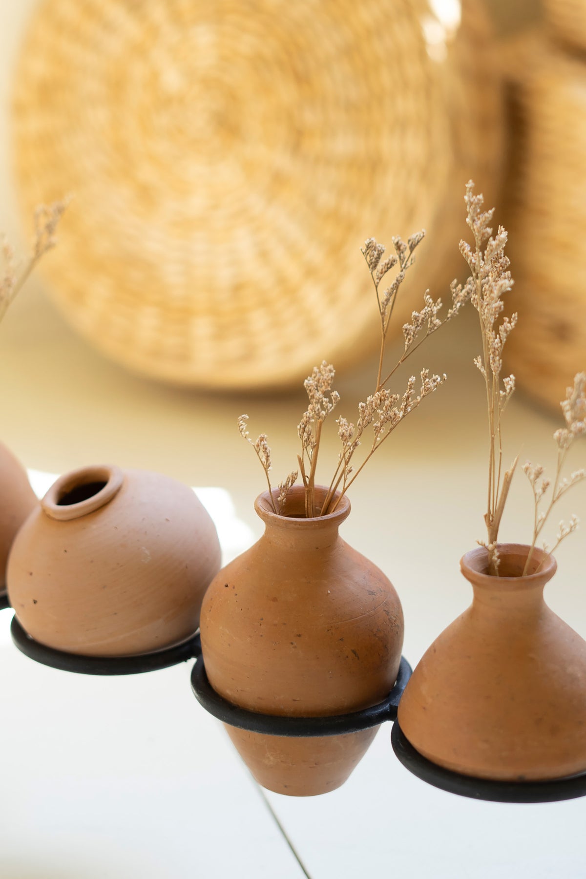Eight Clay Vessels on an Iron Base