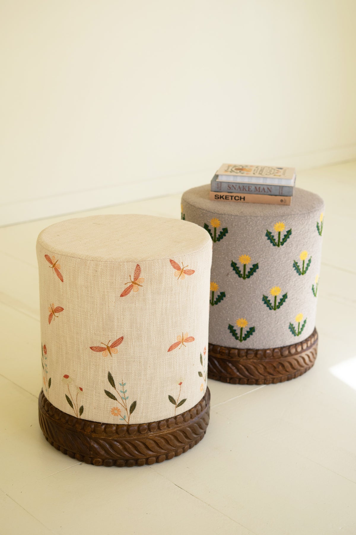 Upholstered Ottoman with Carved Wood Base - Cream